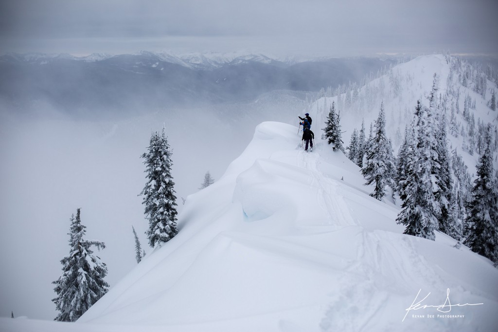 2 skiers on a ridgeline while catskiing in British Columbia at Baldface Lodge 