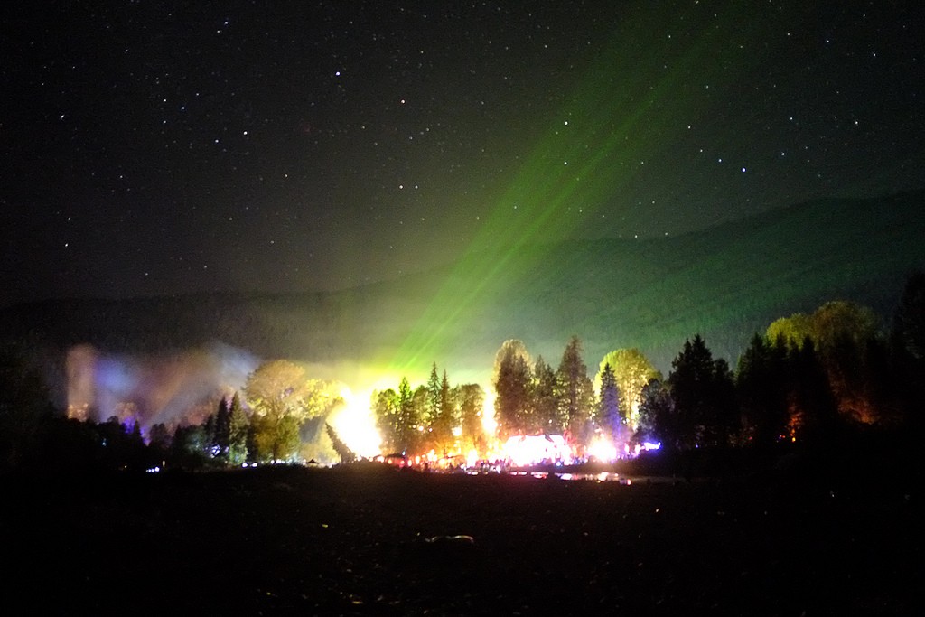 The KING of music festivals in August - Shambhala glittering night sky with a laser show coming off the stage in Nelson BC