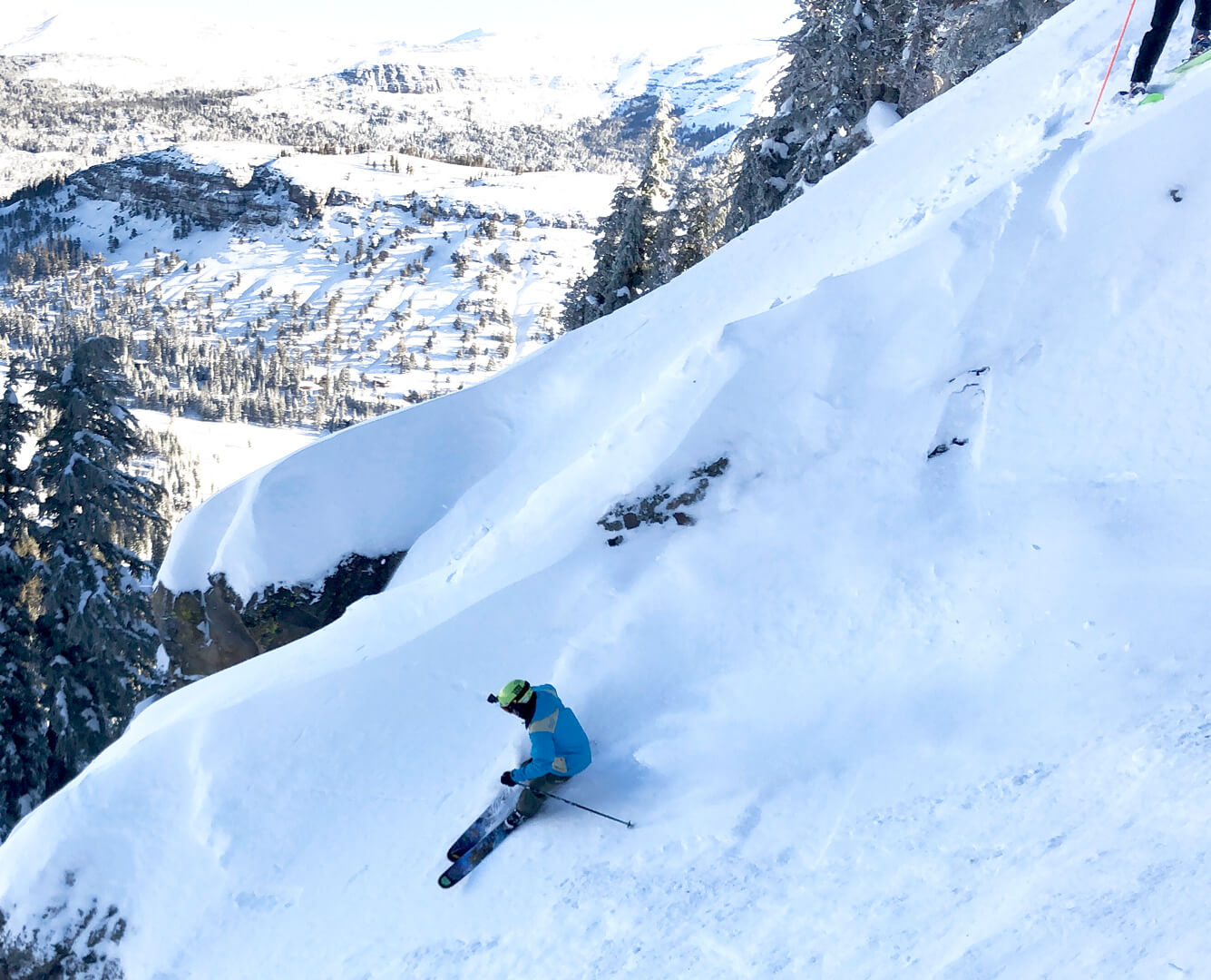 skier in Kirkwood enjoying the fresh snow in a chute