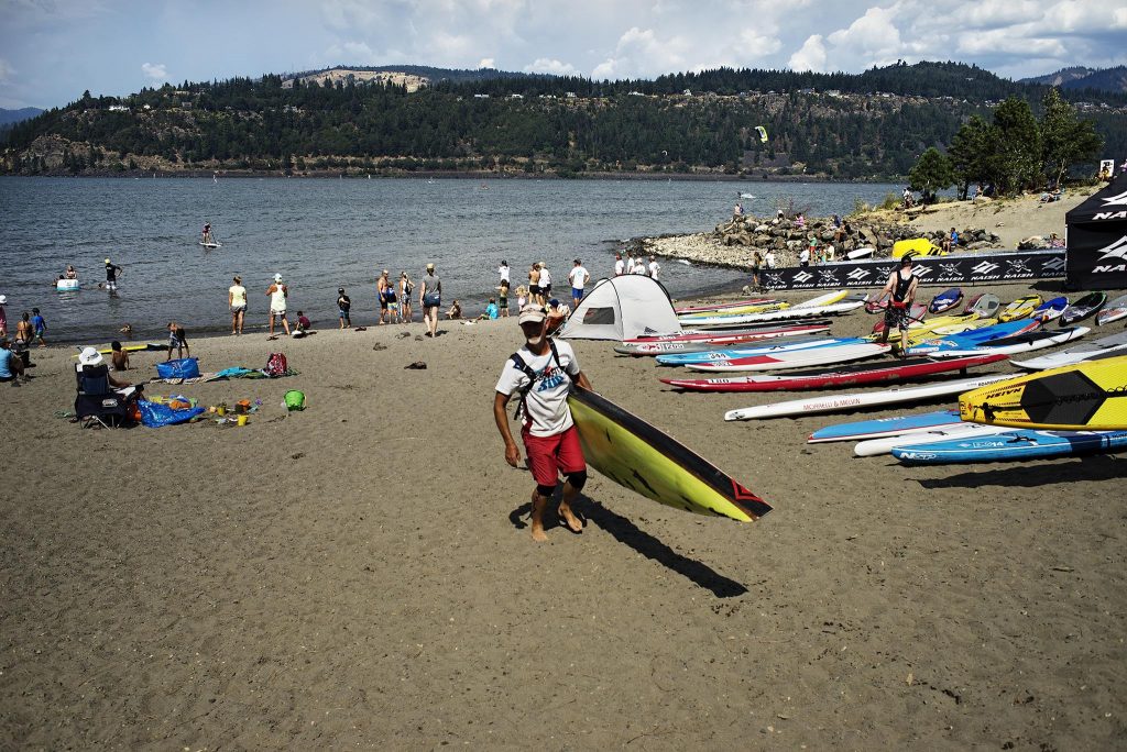 Man walking out of the Gorge Paddle Challenge the premier SUP race festivals in August