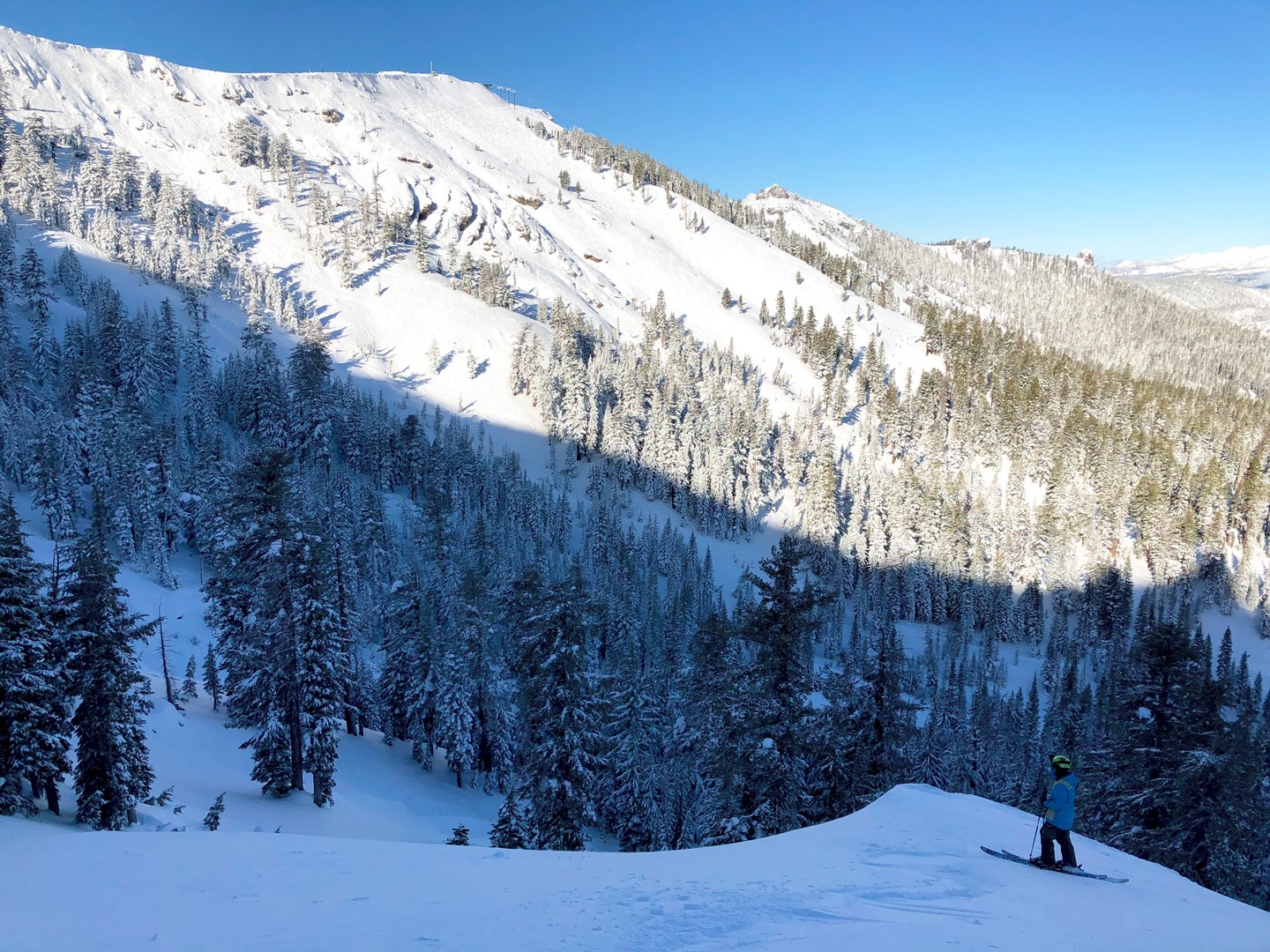 Skier overlooking Kirkwood Mountain and all its trails