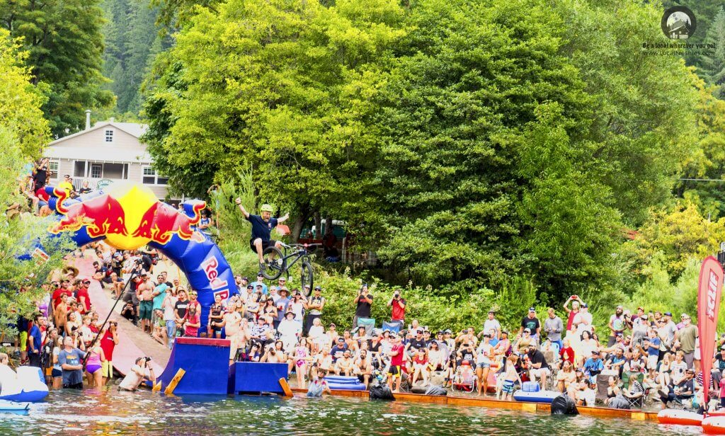 Mountain biker jumping into the river as part of Ryan's House Of Air