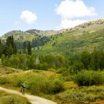 Winding gravel road on the Flume Trail Tahoe with Snowy Peak in the Carson Range in Nevada