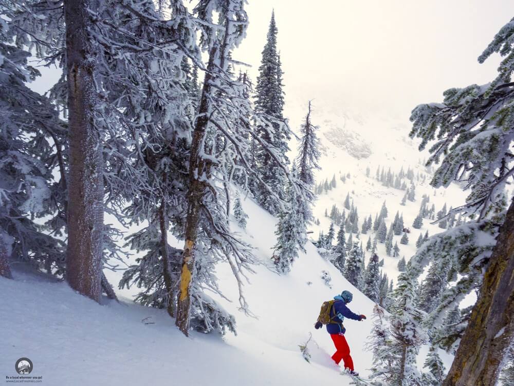 Snowboarding enjoying the deep snow in the Idaho backcountry just outside of Pomerelle Ski Resort