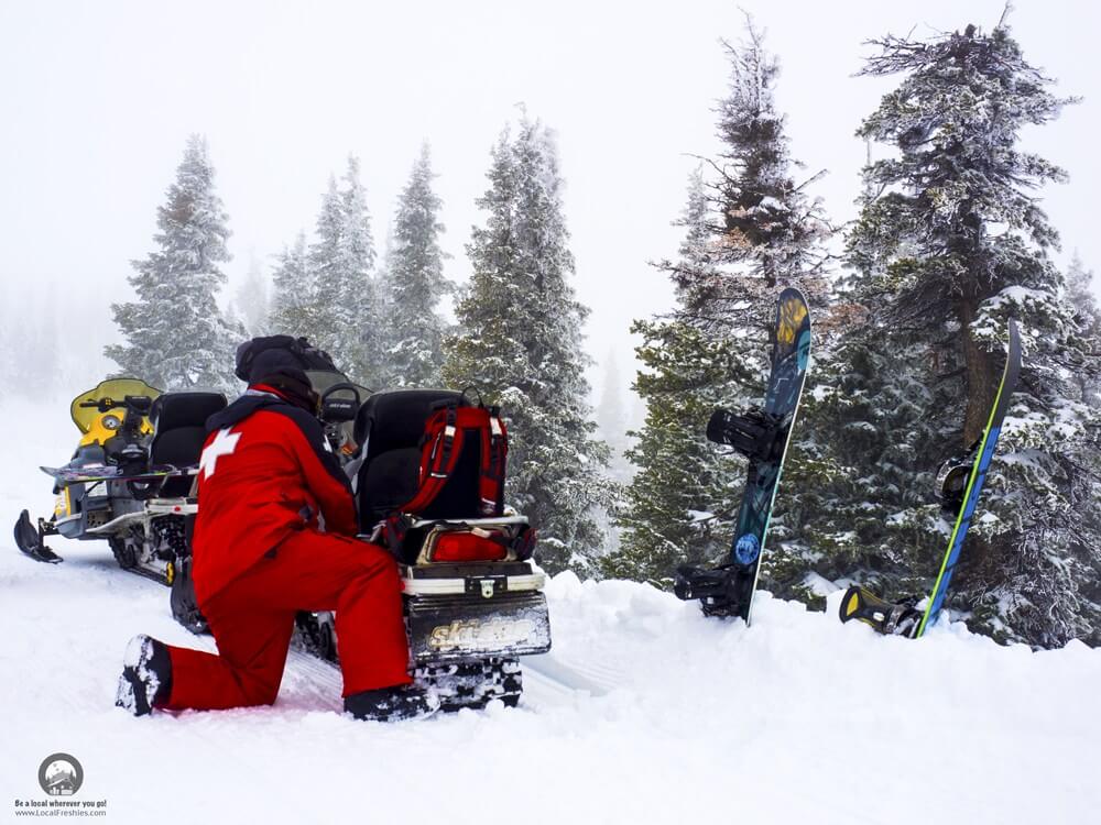 snowmobiling in the Idaho backcountry to find some fresh powder to snowboard in