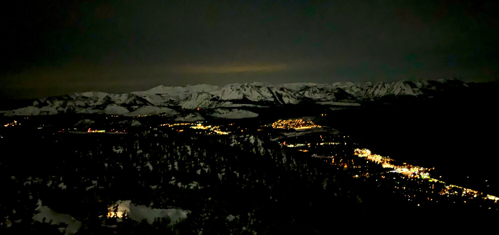 skiing under moonlight night panorama south lake tahoe