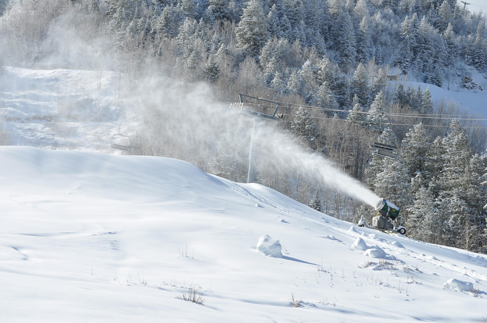 airless snowmaking gun on a sunny winter day