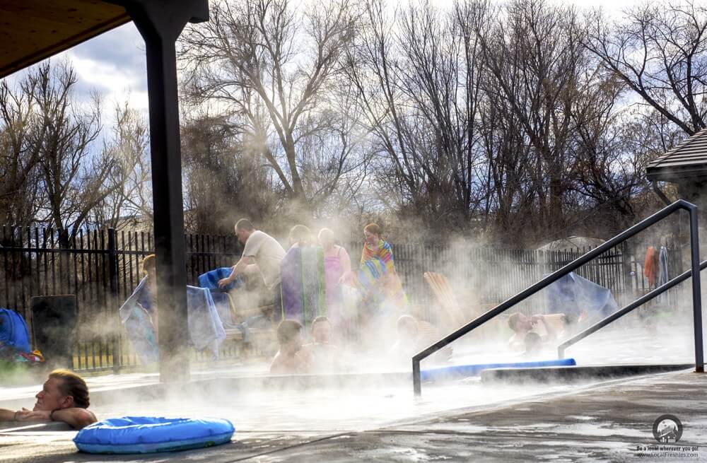 Public steaming pool on a partly cloudy winter day at the Miracle Hot Springs near Twin Falls Idaho