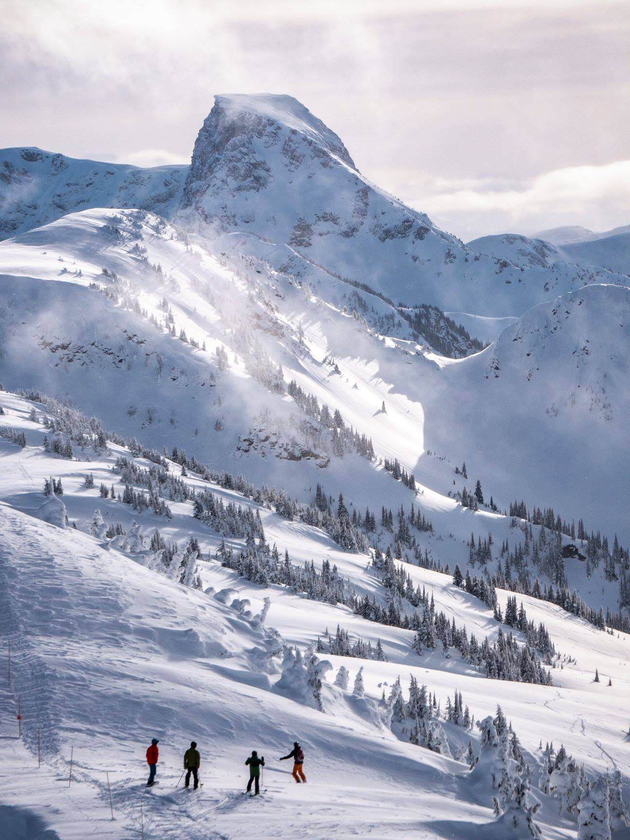 Sunny winter day at Revelstoke Mountain Resort British Columbia showing why it's a great alternative compared to the most popular ski resorts