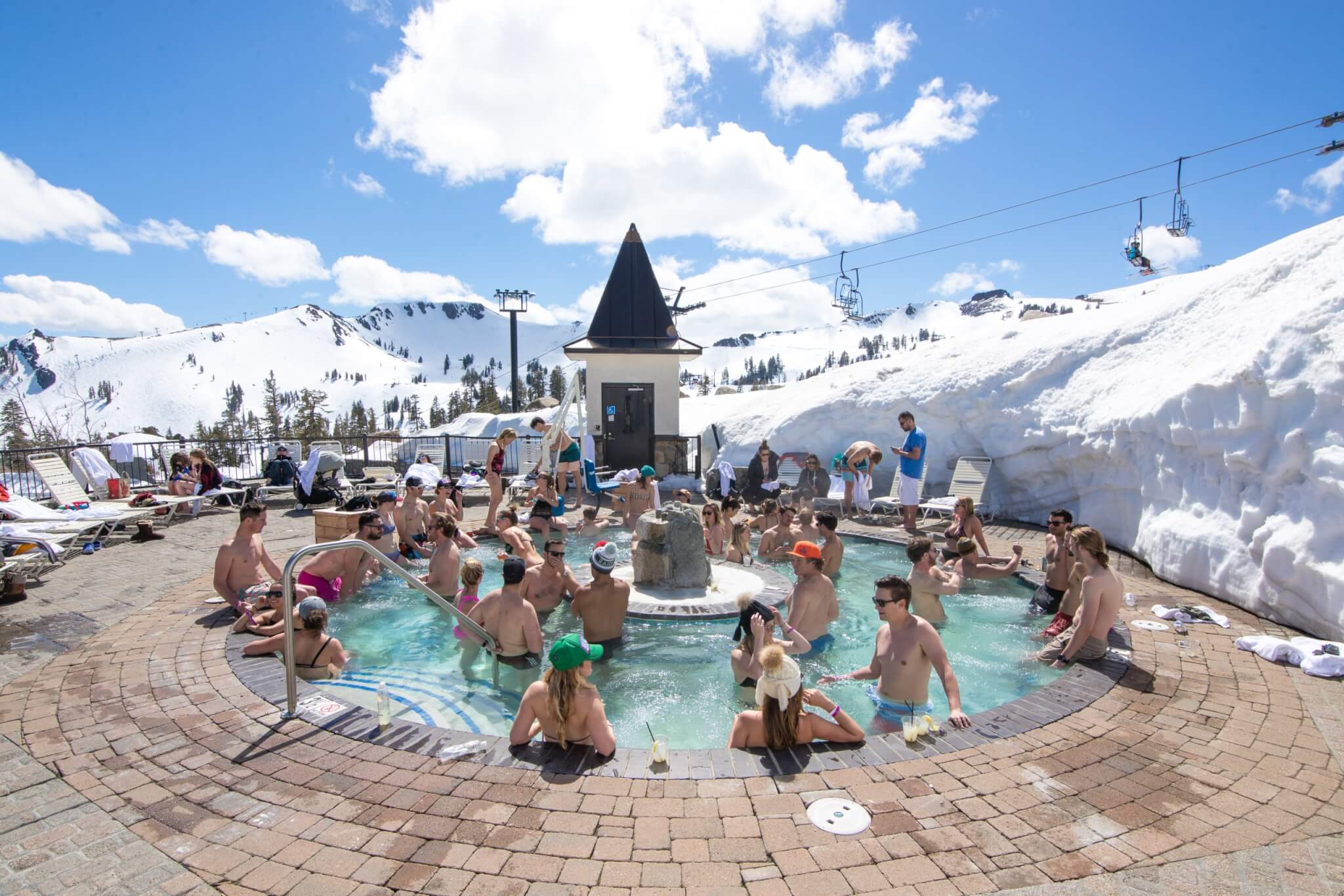 Spring skiing fun with hot tub at Palisades Tahoe in Lake Tahoe California