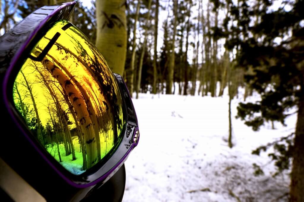 Closeup of Spy Goggles with Aspen Trees behind it