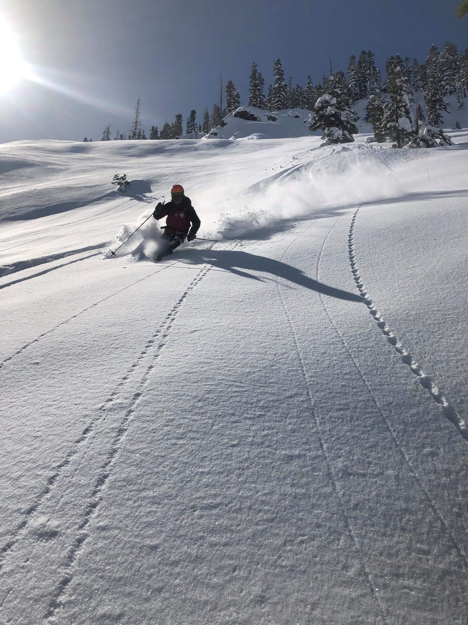 Skier enjoying powder at Bear Valley Resort
