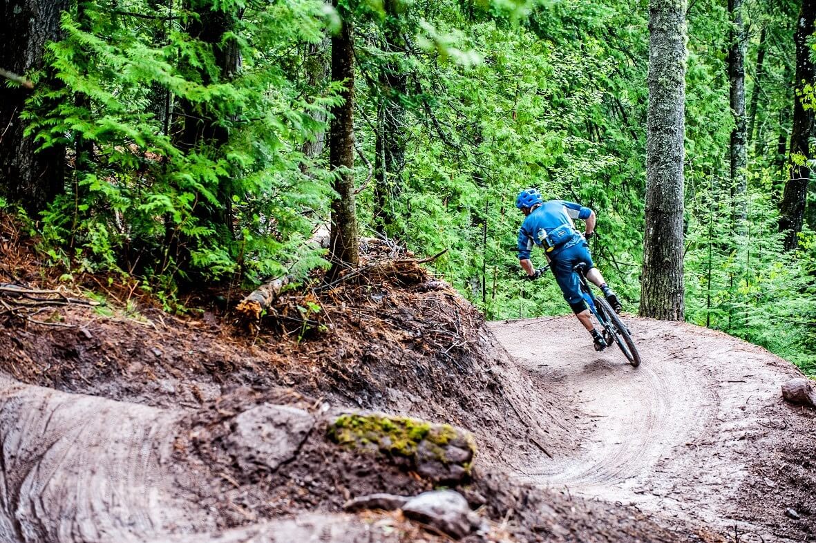 mountain biker enjoying tacky dirt in Copper Harbor Michigan best mountain biking towns