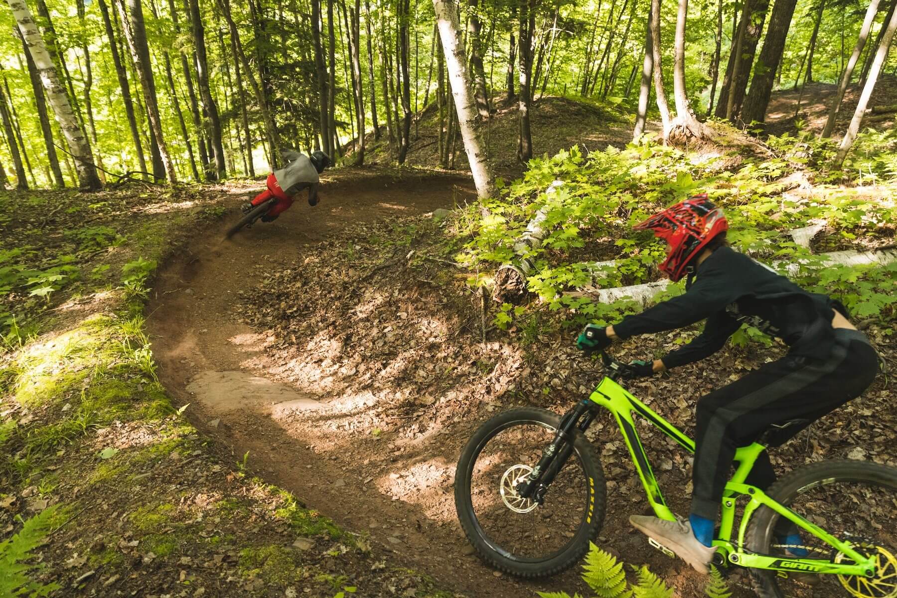 2 bikers enjoying singletrack at mountain bike park at Marquette Mountain