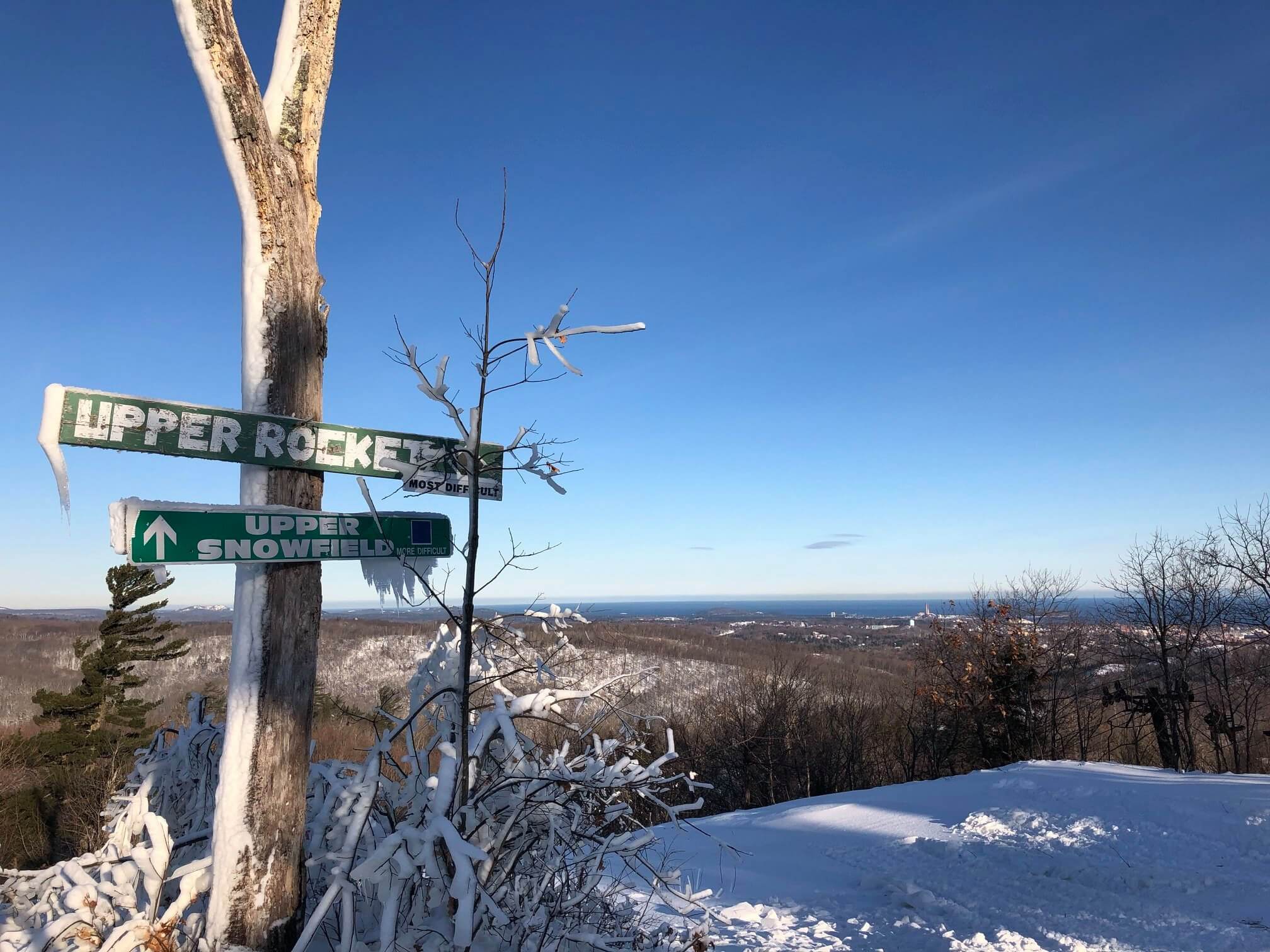 Summit of Marquette Mountain Ski Area overlooking Lake Superior in the distance