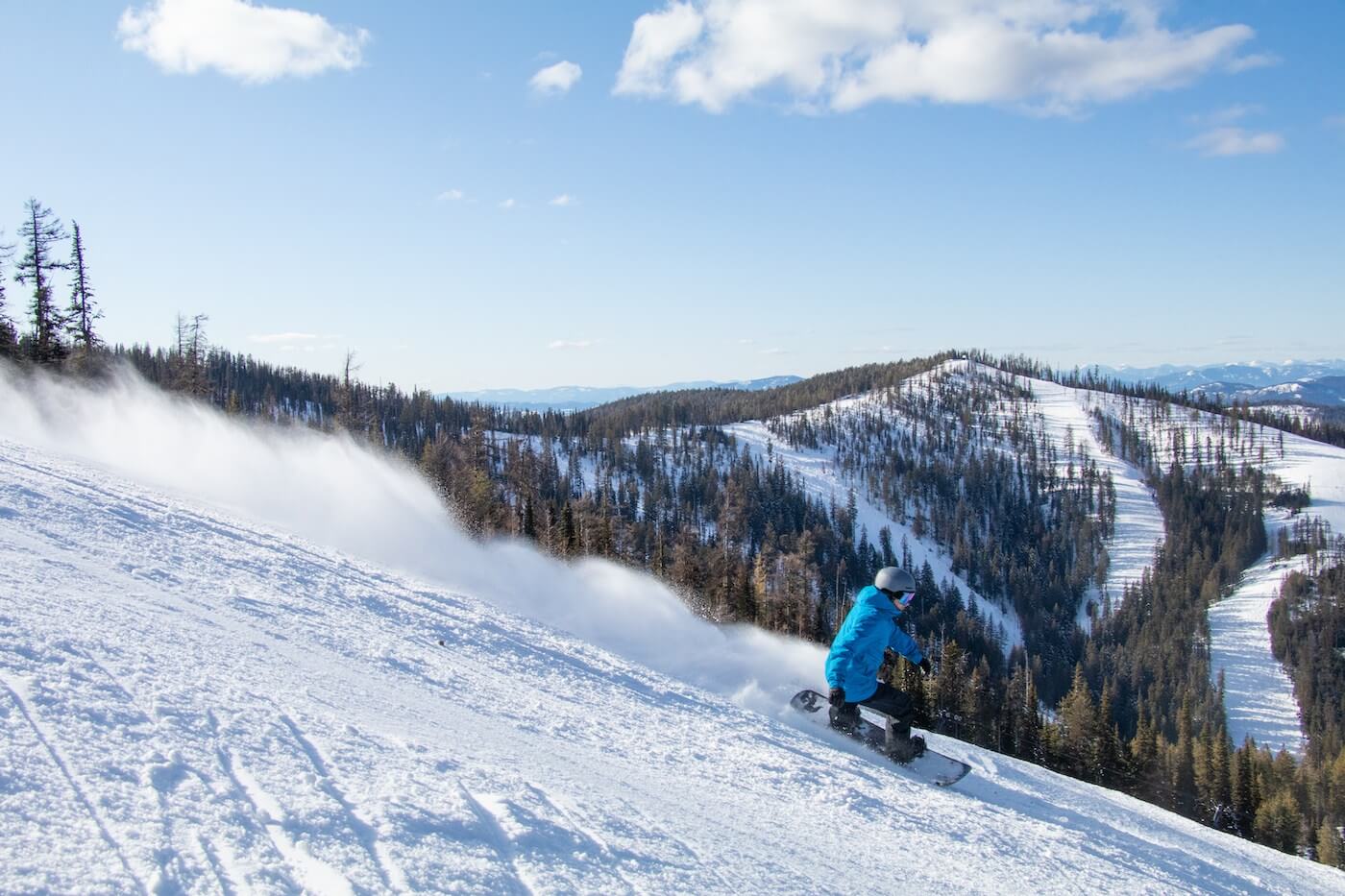 Snowboarder enjoying the soft snow at 49 North Mountain Resort in Washington