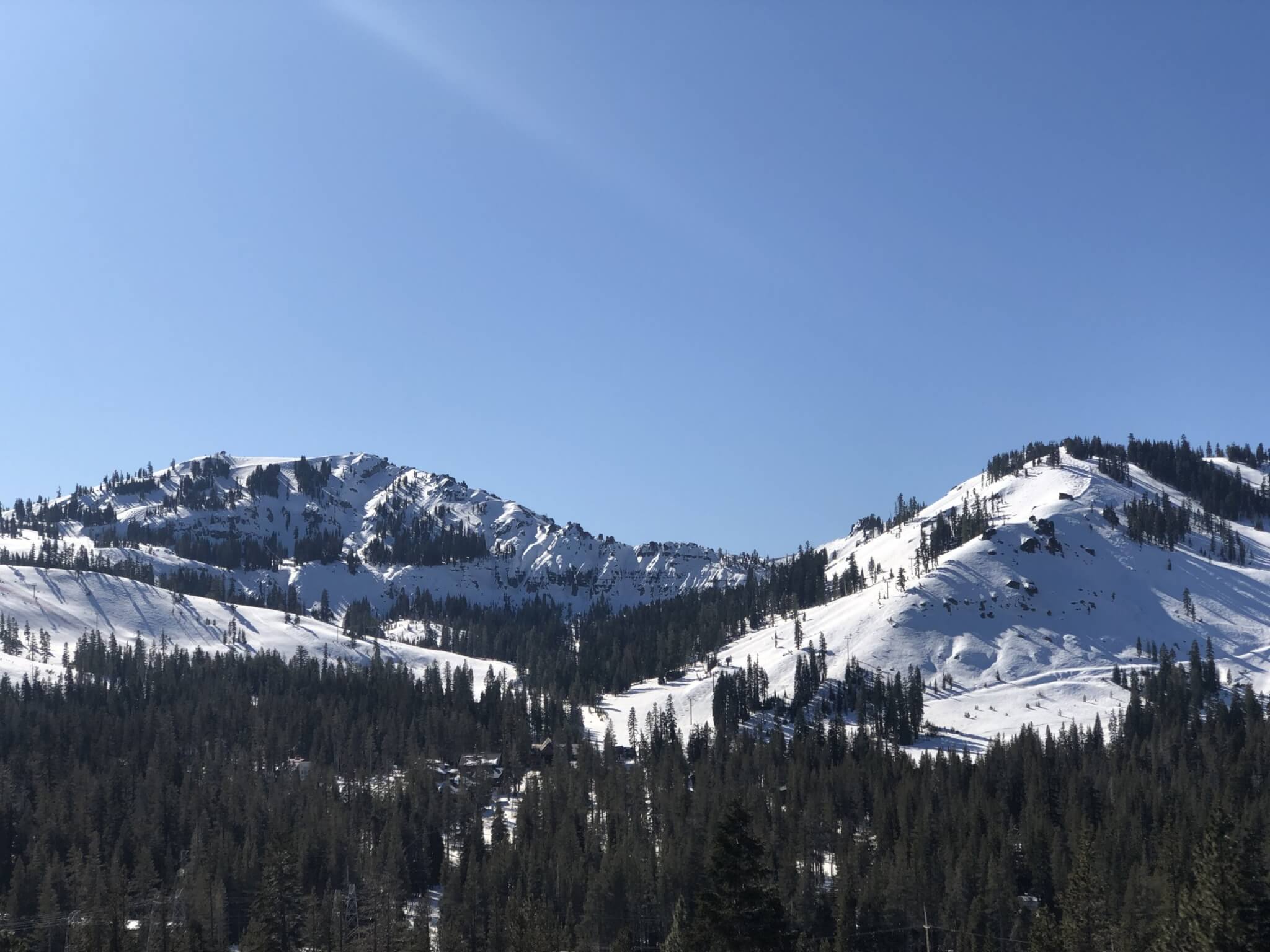 Earn your turns at Sugar Bowl Ski Resort on a sunny spring day