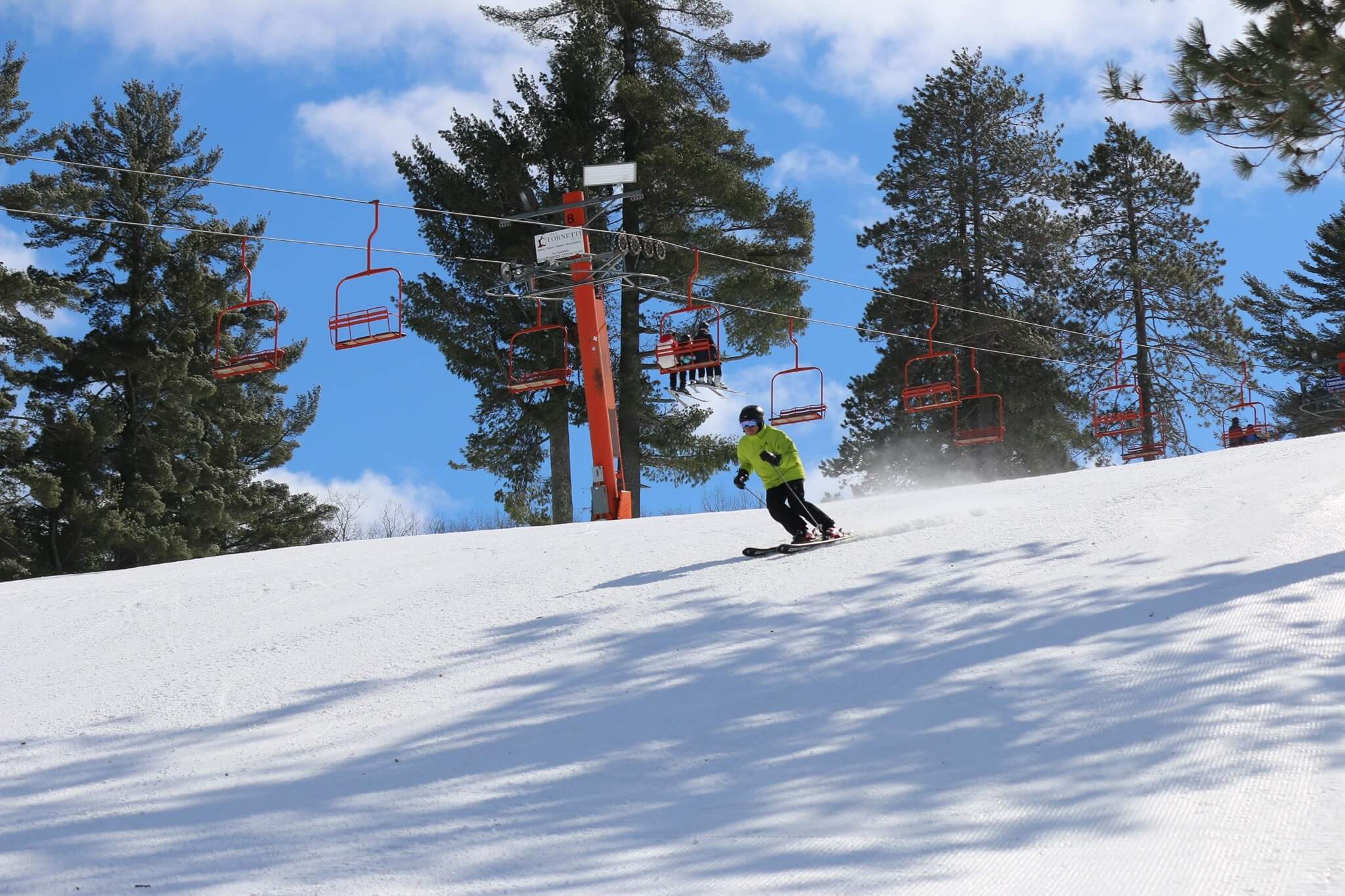 skier going down slopes at Pine Mountain Resort in Upper Peninsula Michigan