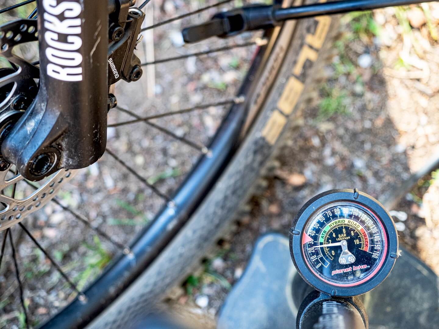 mountain bike pump and tire behind it