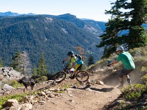 mountain biker enjoying the views off of Stanford Rock near Lake Tahoe