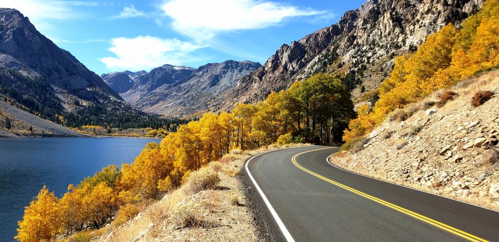 Lundy Lake Road in fall colors with the Eastern Sierra behind it