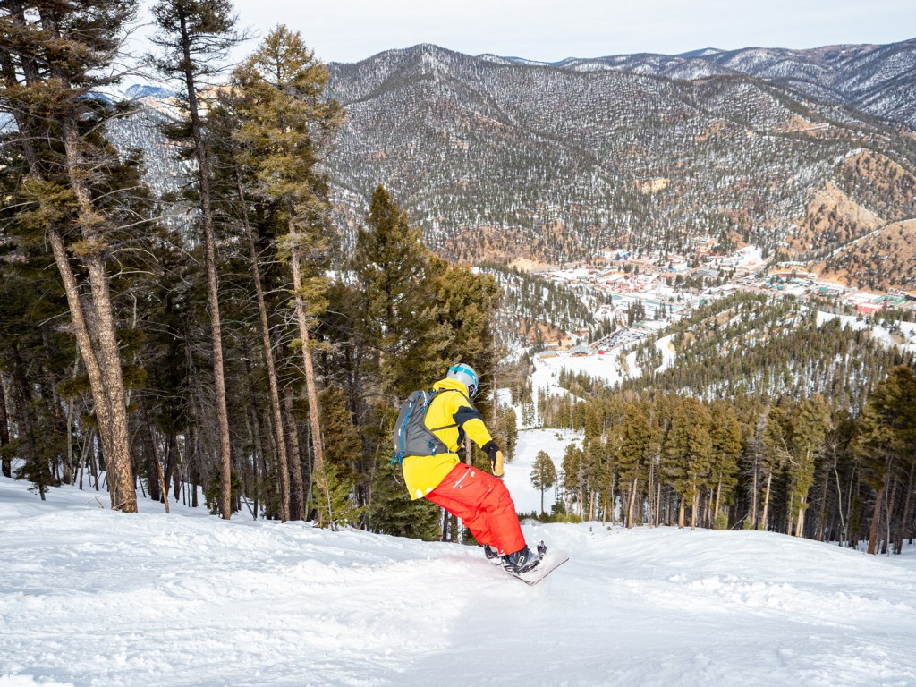 Snowboarder enjoying the soft snow at Red River Ski Resort