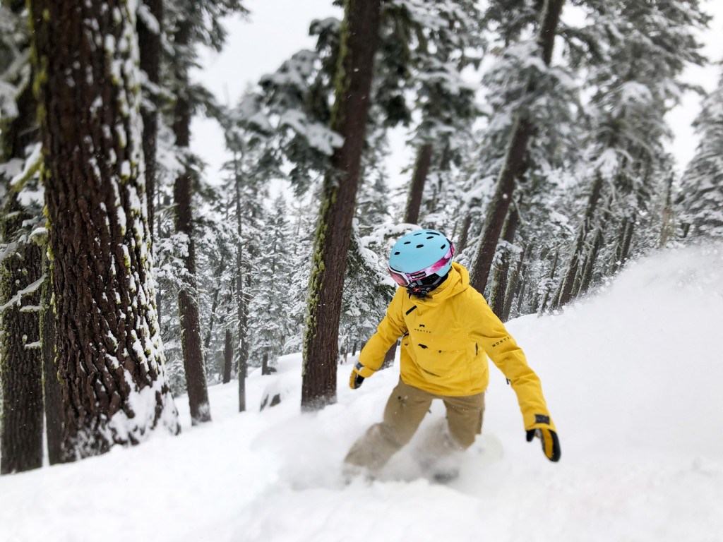Snowboarder enjoying powder at Sierra-at-Tahoe