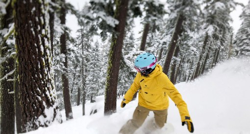 Snowboarder enjoying powder at Sierra-at-Tahoe