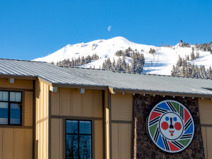 Main building of Mt Bachelor with ski resort and moon rising behind it