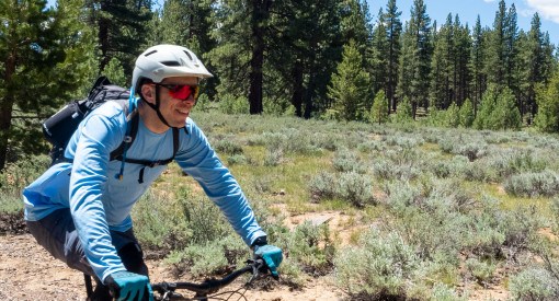 Mountain biker riding in Lake Tahoe Meadow with Smith Attack MTB sunglasses