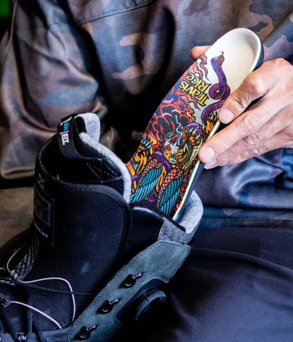 Remind insoles being put into snowboard boots