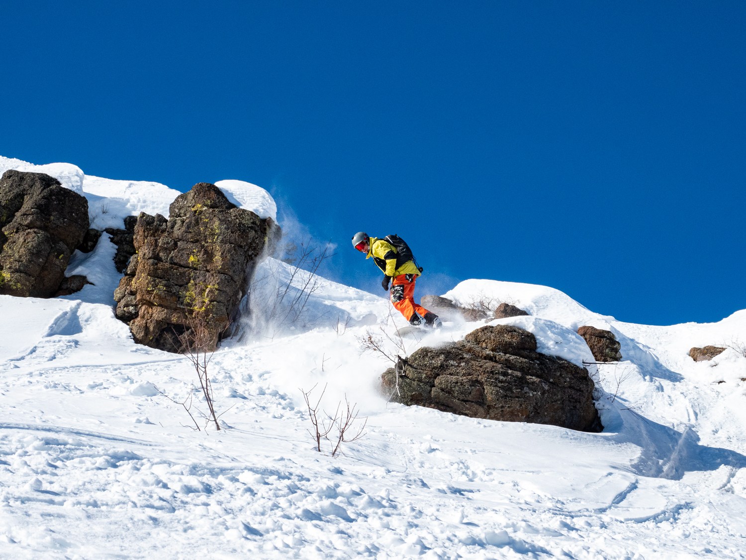 Snowboarder taking a chute at Magic Mountain Ski Resort