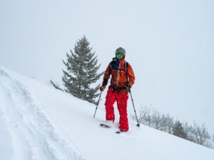 person going down on splitboard while in ski mode