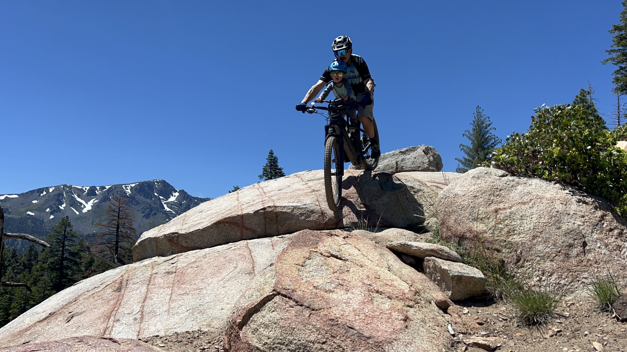 owner of Shoreline of Tahoe mountain biking in Lake Tahoe with his son