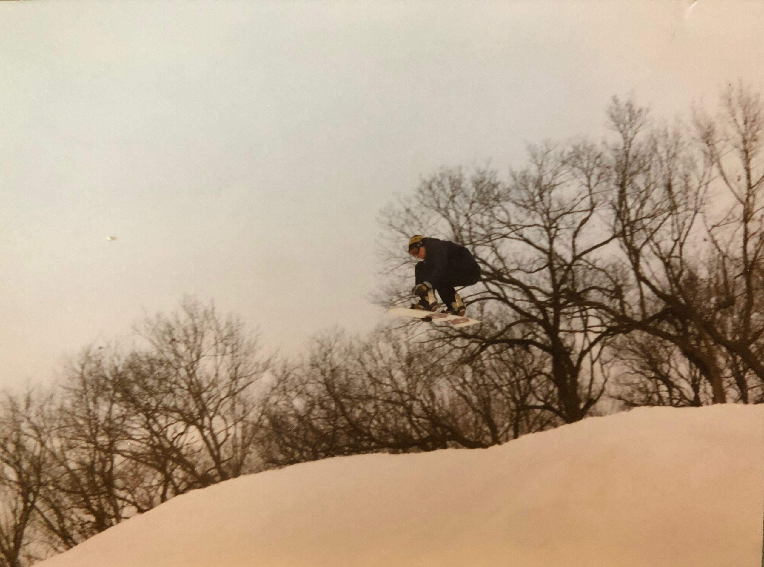 snowboarder riding Burton Jeff Brushie craps board