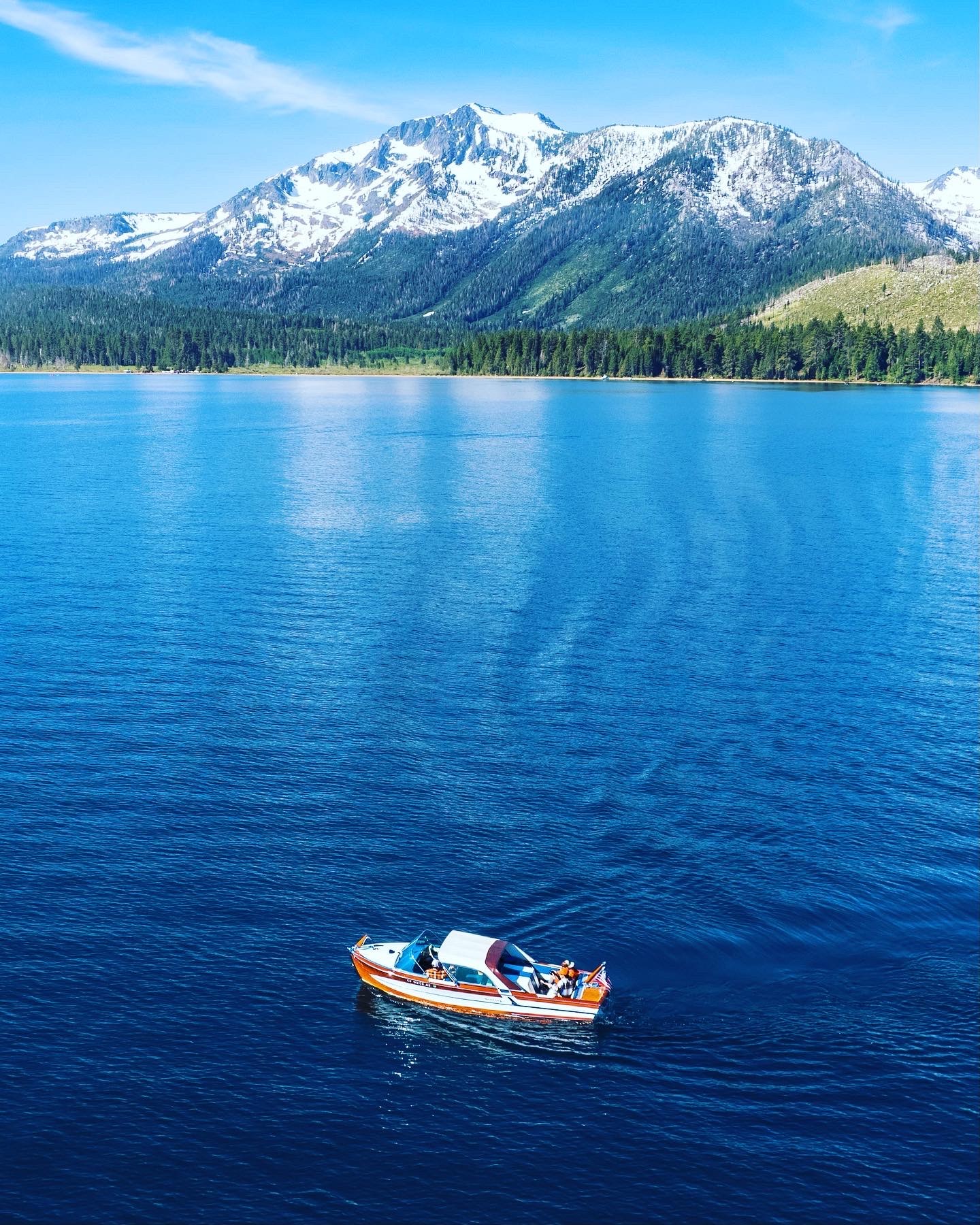 1958 Century Coronado a classic wooden boat on Lake Tahoe with Mt Tallac in the background