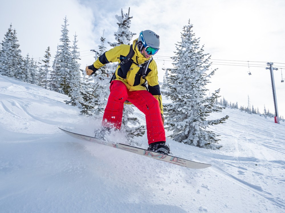 snowboarder enjoying the fresh snow at Brian Head Resort in Utah