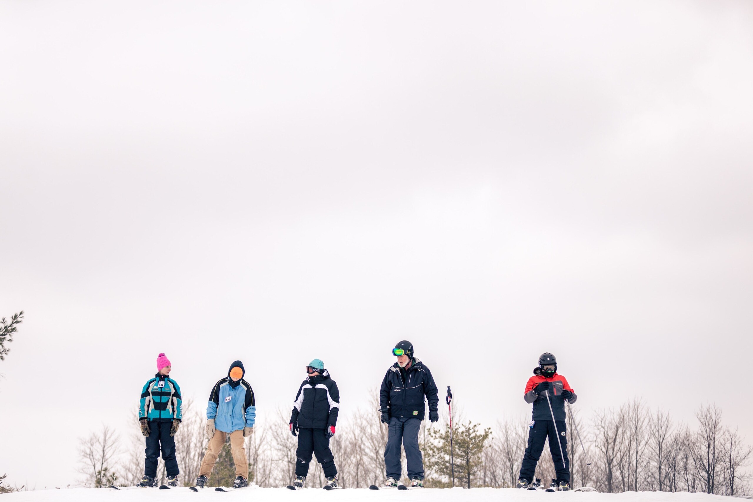 Ski instructor at Norway Mountain Michigan helping kids learn