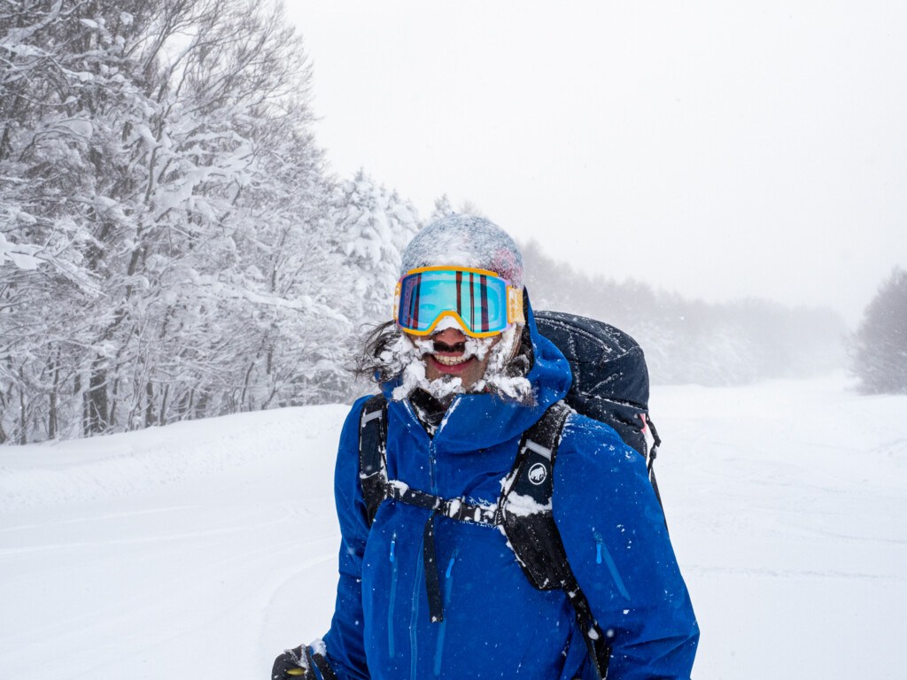 Skier smiling from all the snow at Aomori Spring Resort