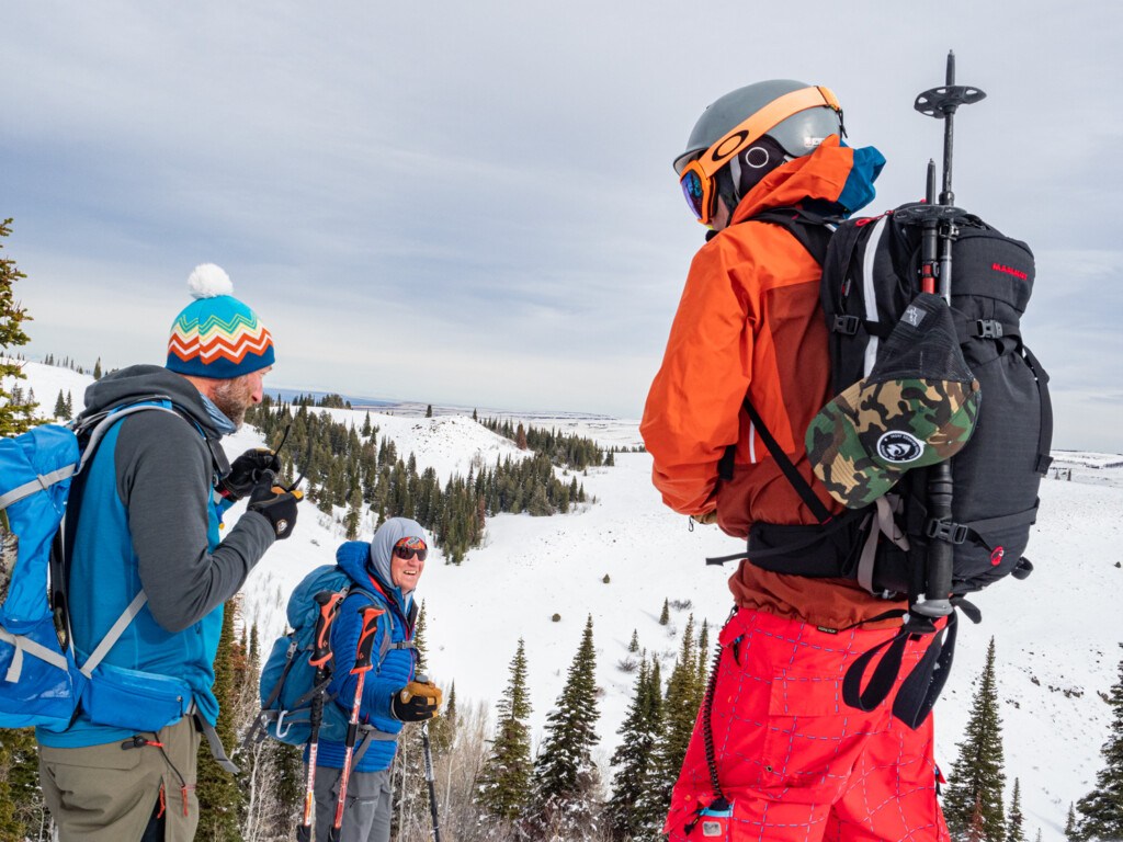 Skiers standing near the summit of Pike Mountain