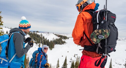 Skiers standing near the summit of Pike Mountain