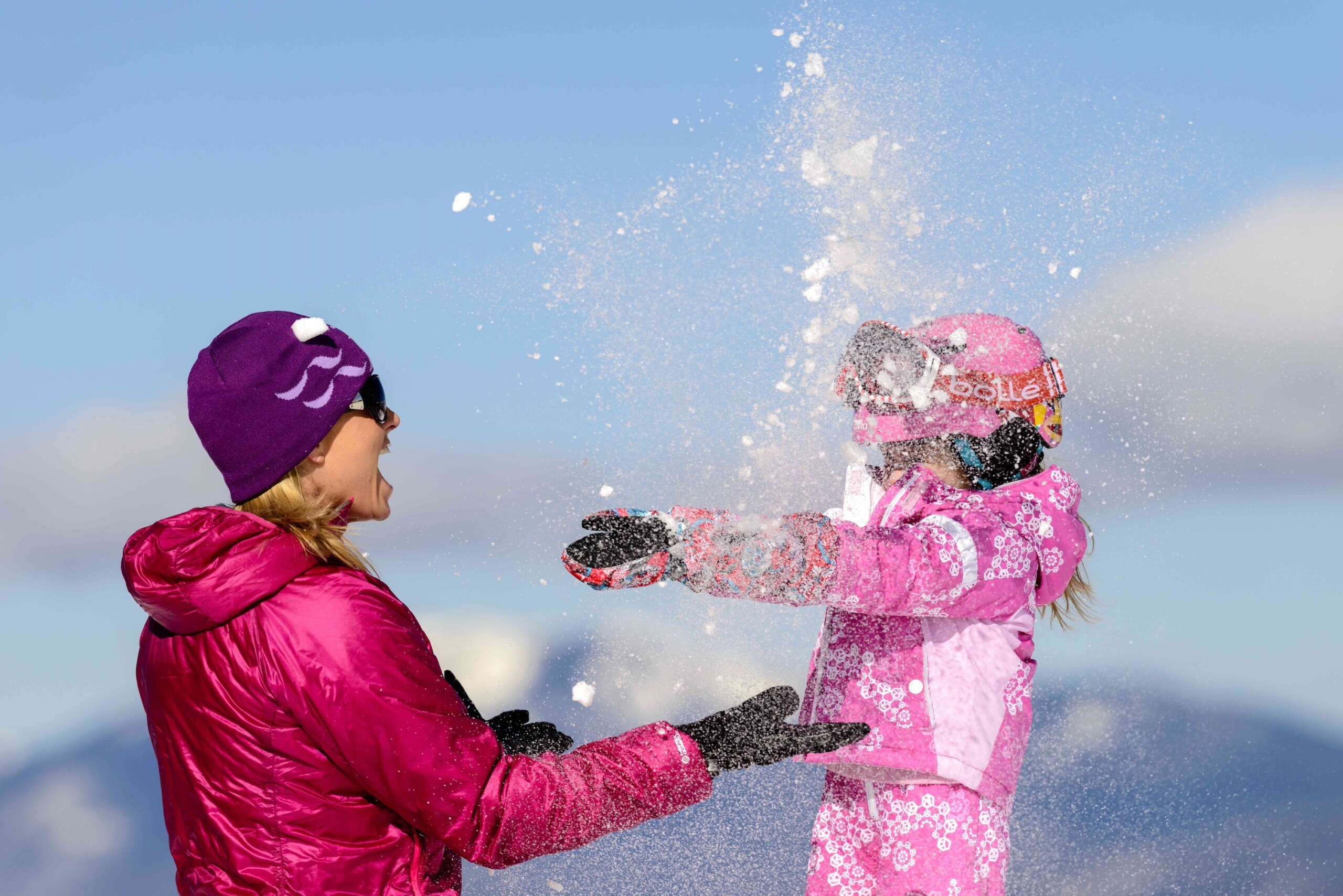 Mom and kid enjoying family skiing in New Mexico