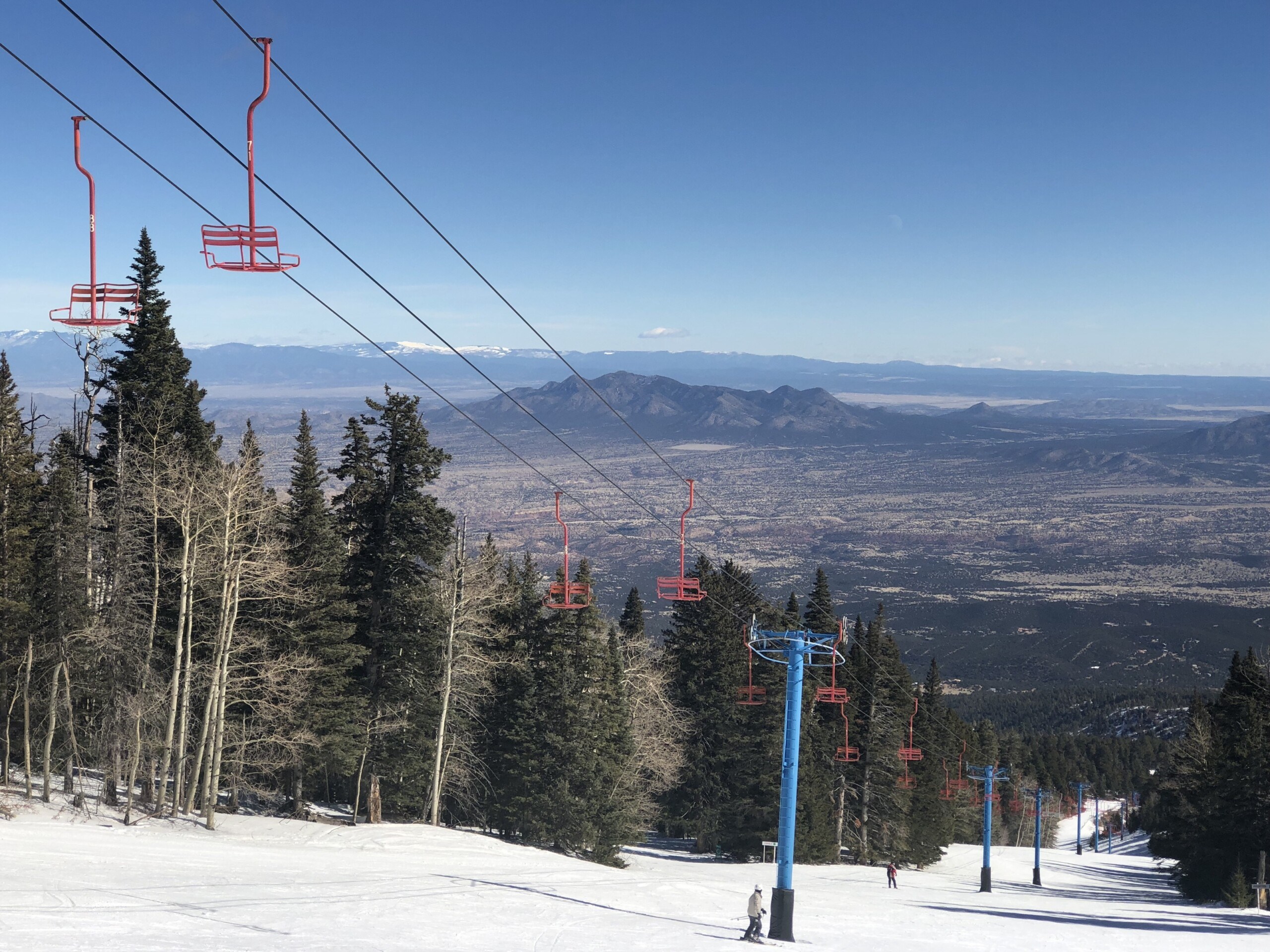 Sandia Peak double chair with Albuquerque New Mexico in the distance