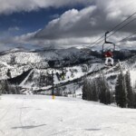 Monarch Mountain on a sunny winter's day with clouds floating above it