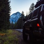 2nd Gen Toyota 4Runner with Mt Hood in the background holding two mountain bikes near 44 Trails