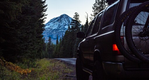 2nd Gen Toyota 4Runner with Mt Hood in the background holding two mountain bikes near 44 Trails