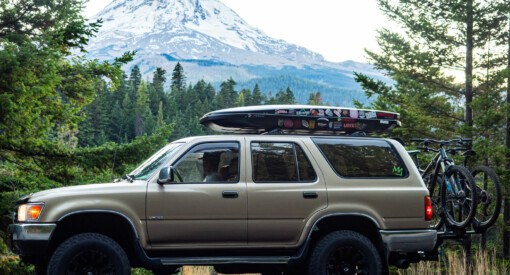 2nd Gen Toyota 4Runner with Mt Hood in the background holding two mountain bikes near 44 Trails