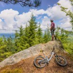 Mountain biker overlooking the surrounding mountains in West Virginia