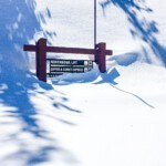 Heavenly ski resort trail sign buried in snow