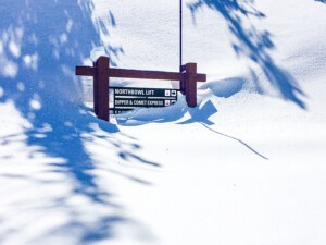 Heavenly ski resort trail sign buried in snow